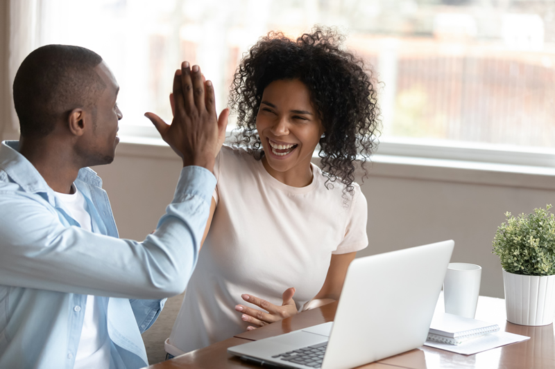 Photo of couple high-fiving