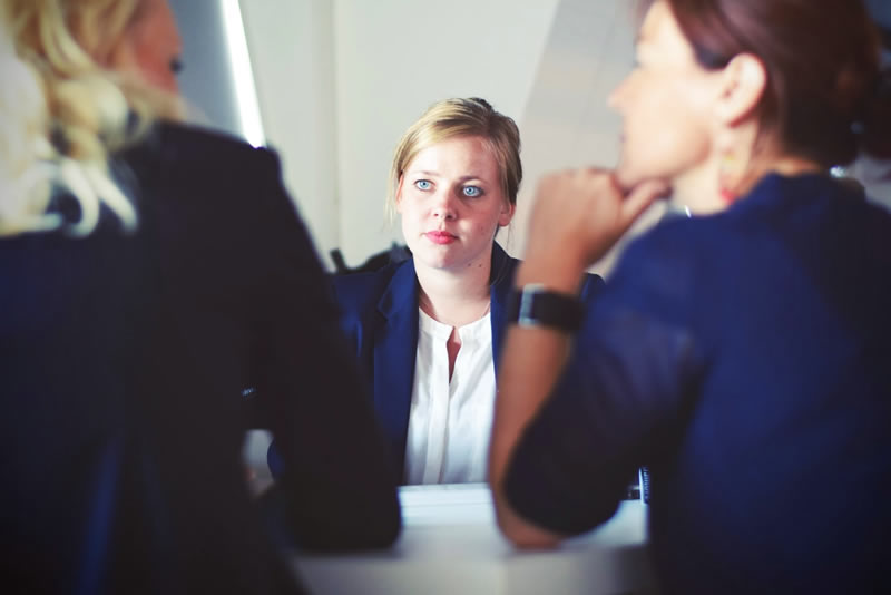 3 women meeting at a table