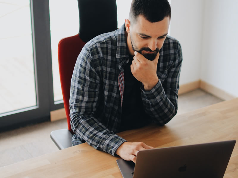 Man looking at a computer