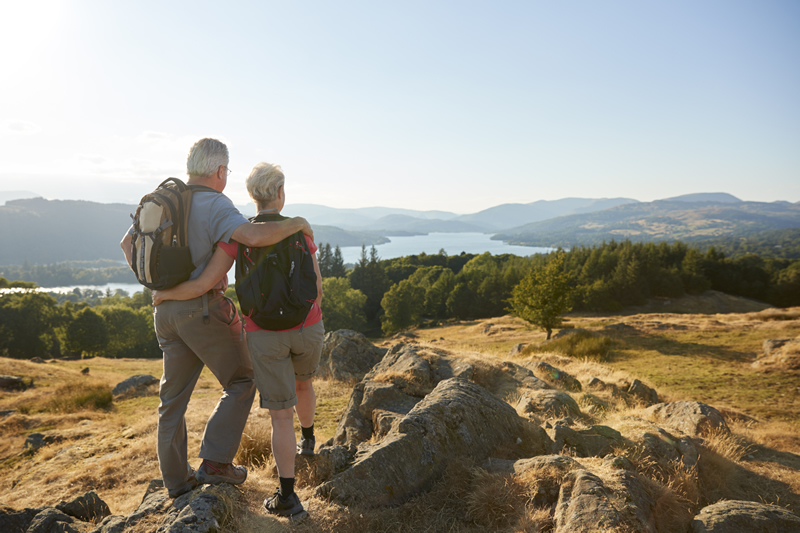 Photo of retired couple backpacking